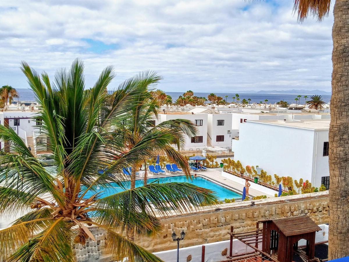 Appartement Aguazul - A Pie De Piscina Y Vistas Al Mar à Puerto del Carmen  Extérieur photo